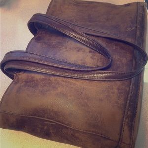 Coach brown leather tote with full zipper top.